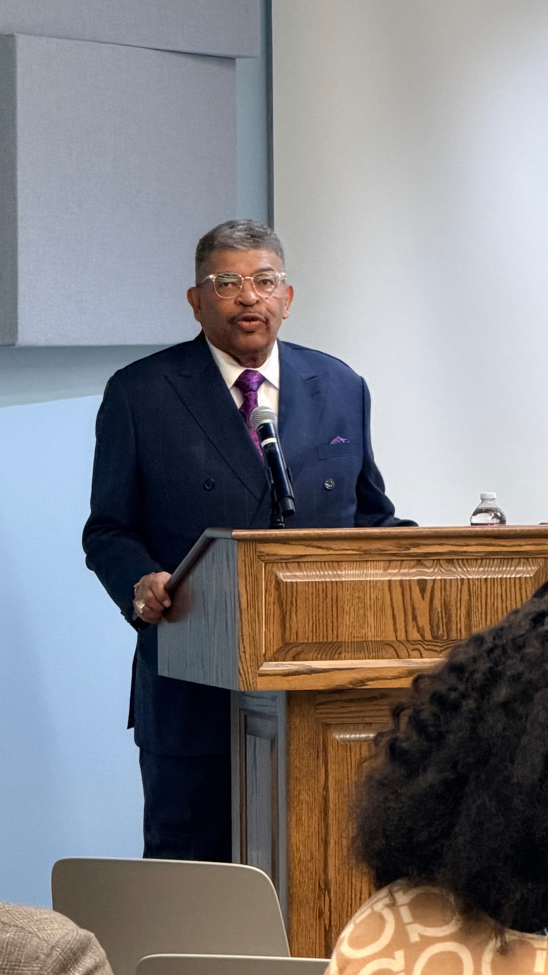 Panelist speaking at the podium during the DASH Leadership launch