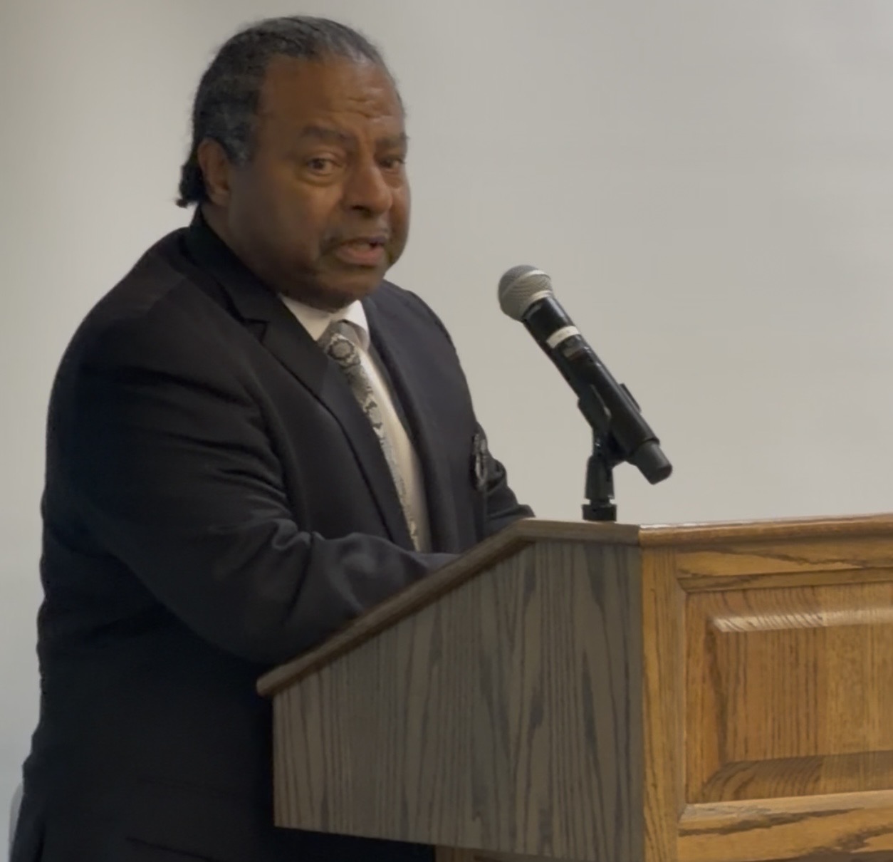 A speaker addressing the audience from the podium during a DASH Leadership event