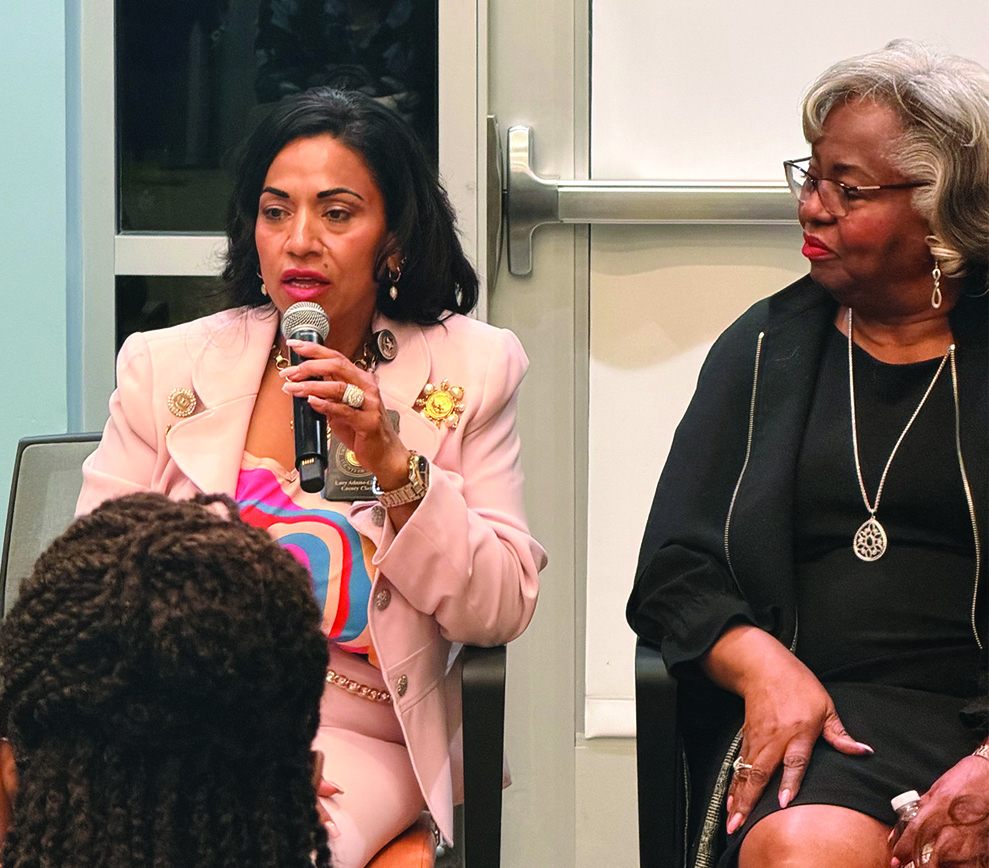 Bexar County Clerk Lucy Adame-Clark speaking on a panel alongside a fellow panelist